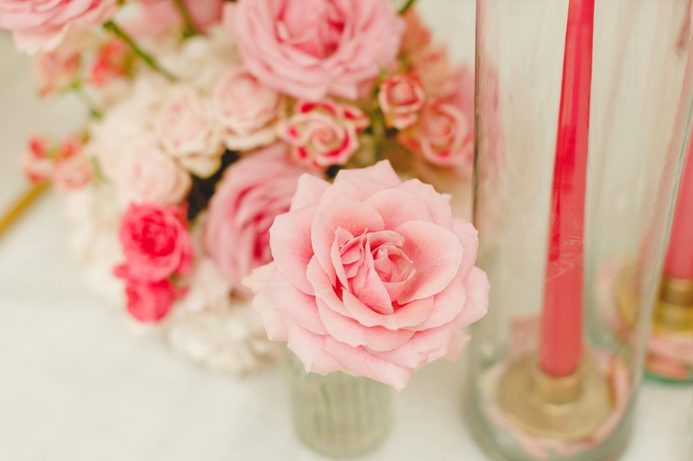 Close-up of pink roses in a floral arrangement for a wedding