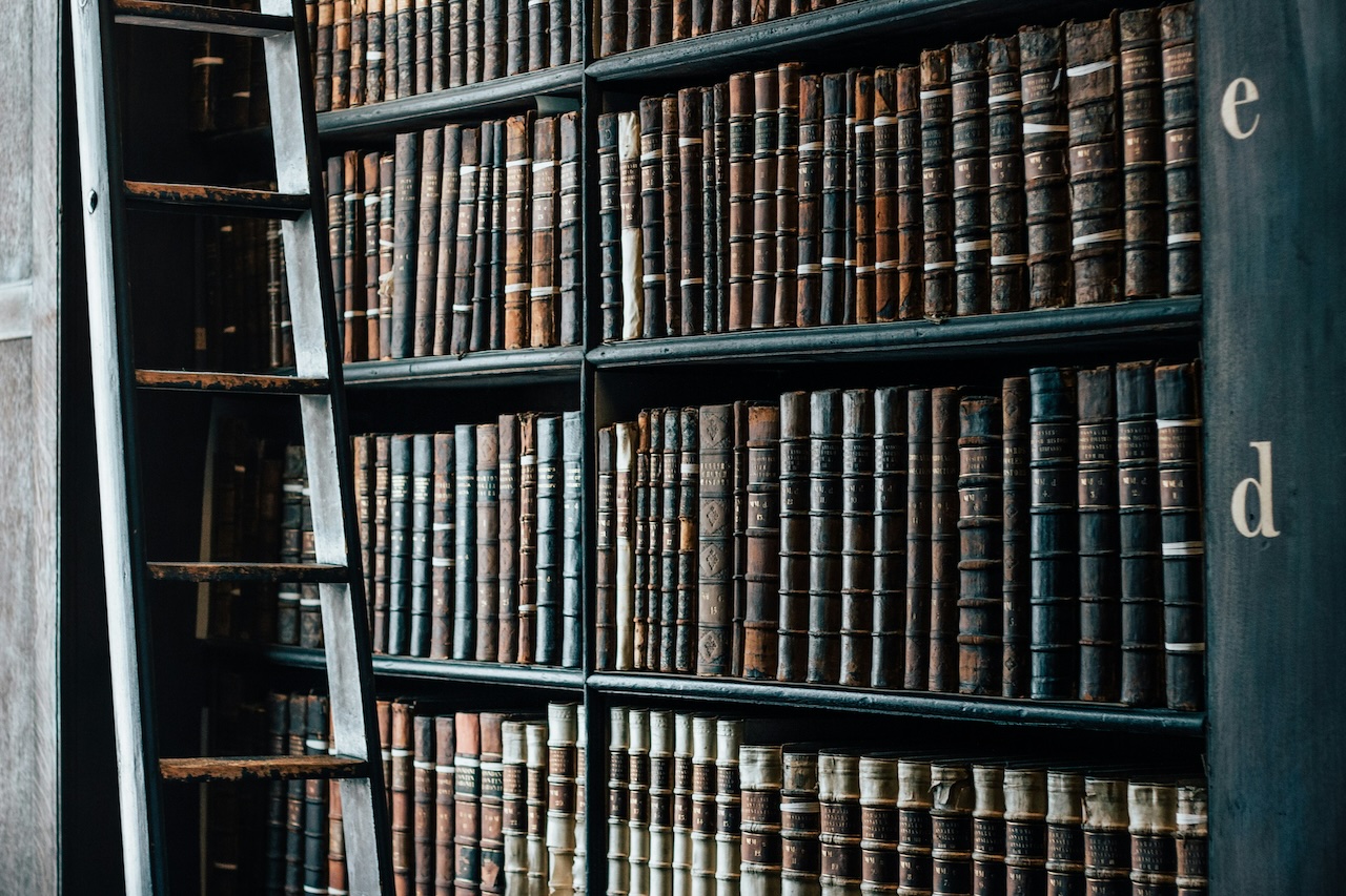 A historic law library with a ladder, representing the depth of legal research behind effective prenuptial agreements.