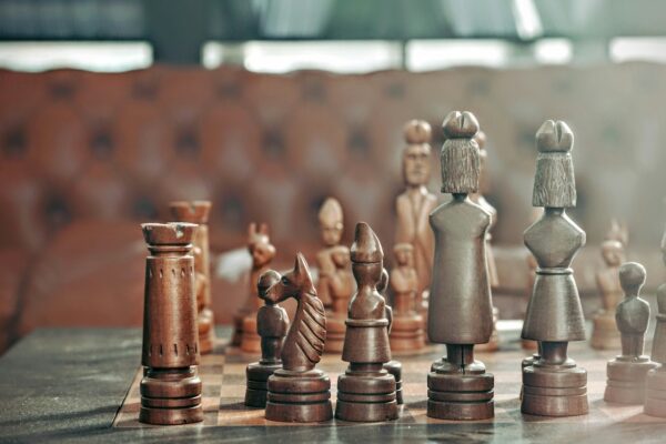 A beautifully carved chess set, symbolizing strategic legal planning in prenuptial agreements.