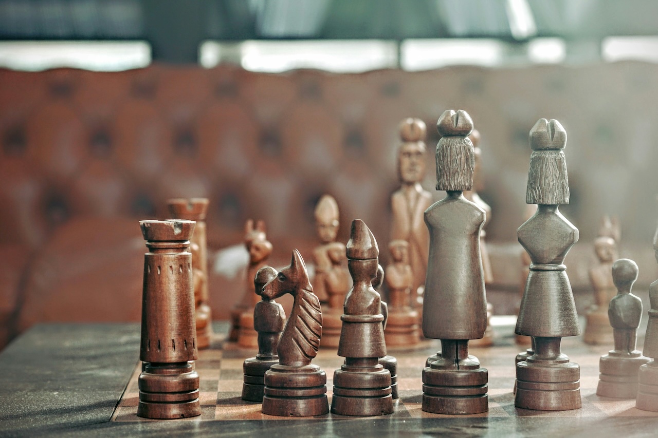 A beautifully carved chess set, symbolizing strategic legal planning in prenuptial agreements.